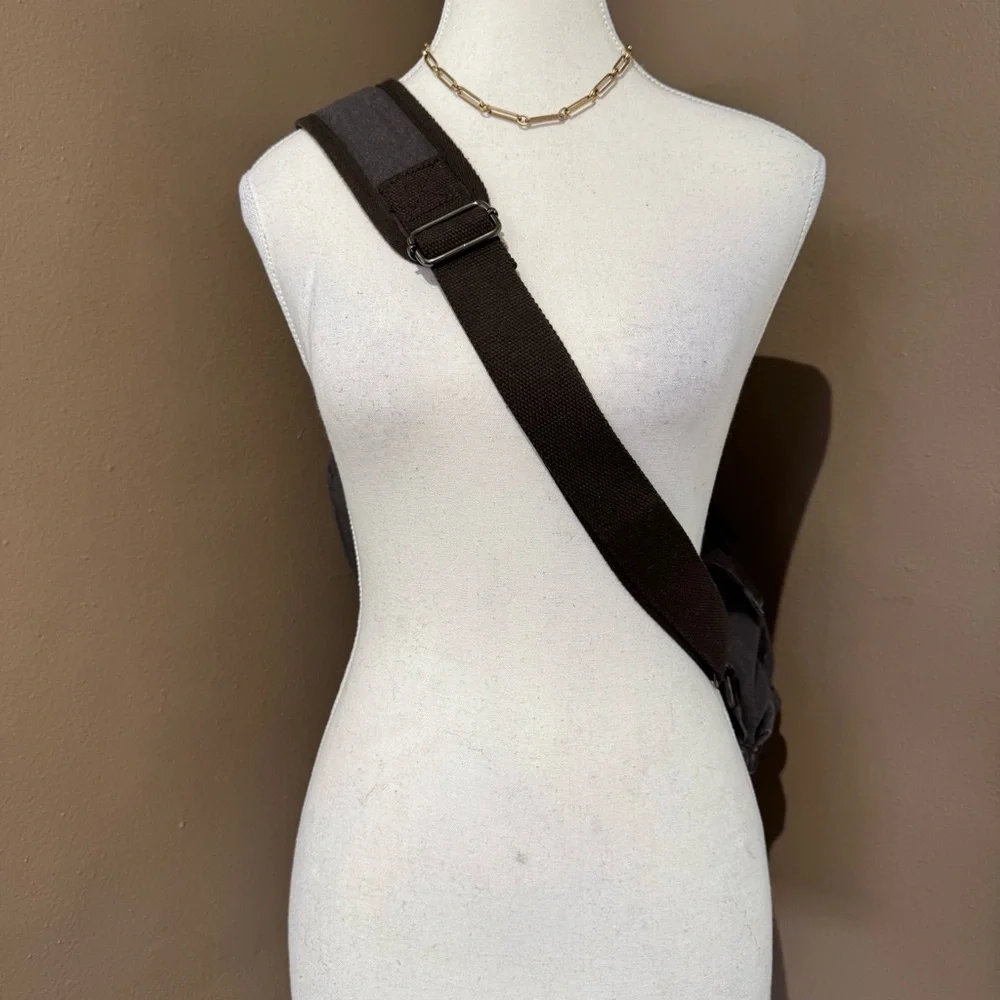 Gray Canvas Crossbody Backpack with Brown Accents Multiple Compartments Durable